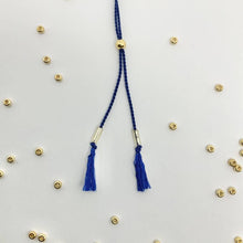 Load image into Gallery viewer, Close-up photo showing the detail of the adjustable sliding bead on our 'Carpe Diem' Morse Code Bracelet