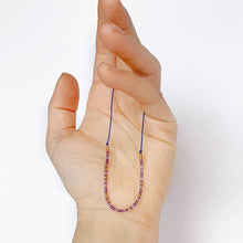 Load image into Gallery viewer, 'Carpe Diem' Morse Code Bead Bracelet displayed in hand