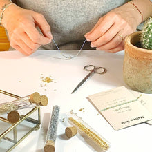 Load image into Gallery viewer, Custom Made Morse Code Bead Bracelet being handmade, with tubes of Miyuki beads on table