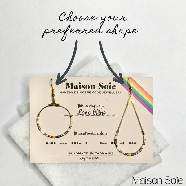 Close up photo of the beads on our 'Love Wins' Pride Morse Code Earrings