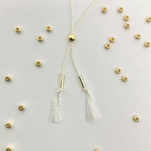Load image into Gallery viewer, Close-up photo showing the detail of the adjustable sliding bead on our 'Grandma' Morse Code Bracelet