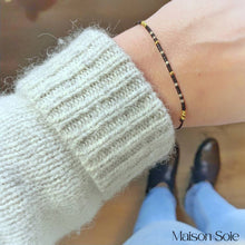 Load image into Gallery viewer, 'Grateful' Morse Code Bead Bracelet in black being worn