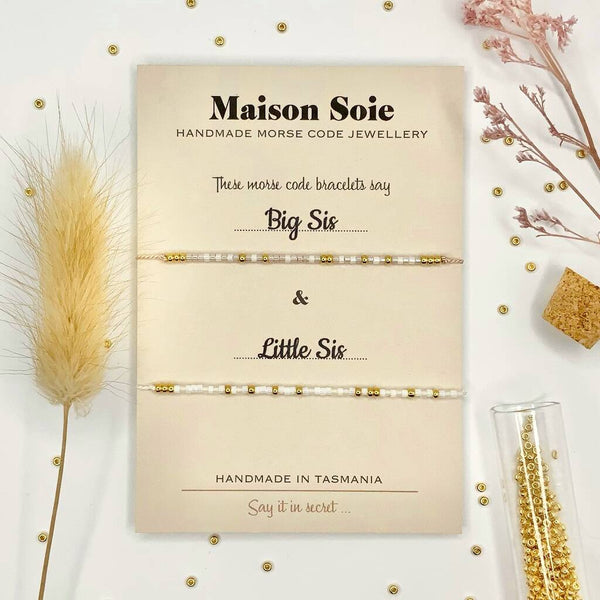 Duo Collection - Morse Code bead bracelets that spell 'Big Sis & Little Sis' displayed on a presentation card