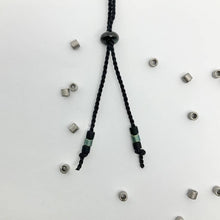 Load image into Gallery viewer, Close-up photo showing the detail of the adjustable sliding bead on our 'Brother' Mens Morse Code Bracelet