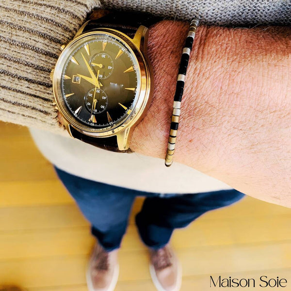Close-up photo showing the detail of the adjustable sliding bead on our 'Miss You' Mens Morse Code Bracelet