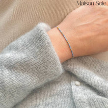Load image into Gallery viewer, 'Miss You' Morse Code Bead Bracelet in 'Earl Grey' colour being worn