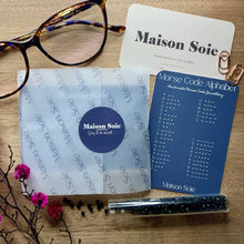 Load image into Gallery viewer, Example of the packaging and presentation for 'Libra' Zodiac Morse Code bead bracelet