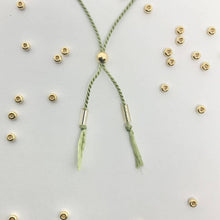 Load image into Gallery viewer, 'Pisces' Zodiac Morse Code bead bracelet - close up detail of adjustable sliding bead