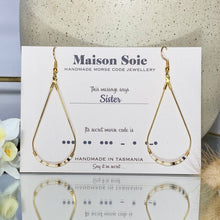 Load image into Gallery viewer, Morse Code Earrings displayed on a presentation card - the beads are arranged using Morse Code to spell out the word 'Sister'
