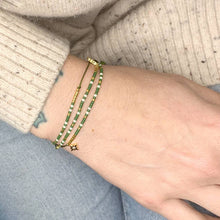 Load image into Gallery viewer, 'Taurus' Zodiac Morse Code bead bracelet being worn