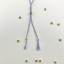 Load image into Gallery viewer, Close-up photo showing the detail of the adjustable sliding bead on our 'Thank You' Morse Code Bracelet