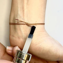 Load image into Gallery viewer, Once you have trimmed any excess thread, apply a bit of clear nail polish to the ends to stop them fraying.