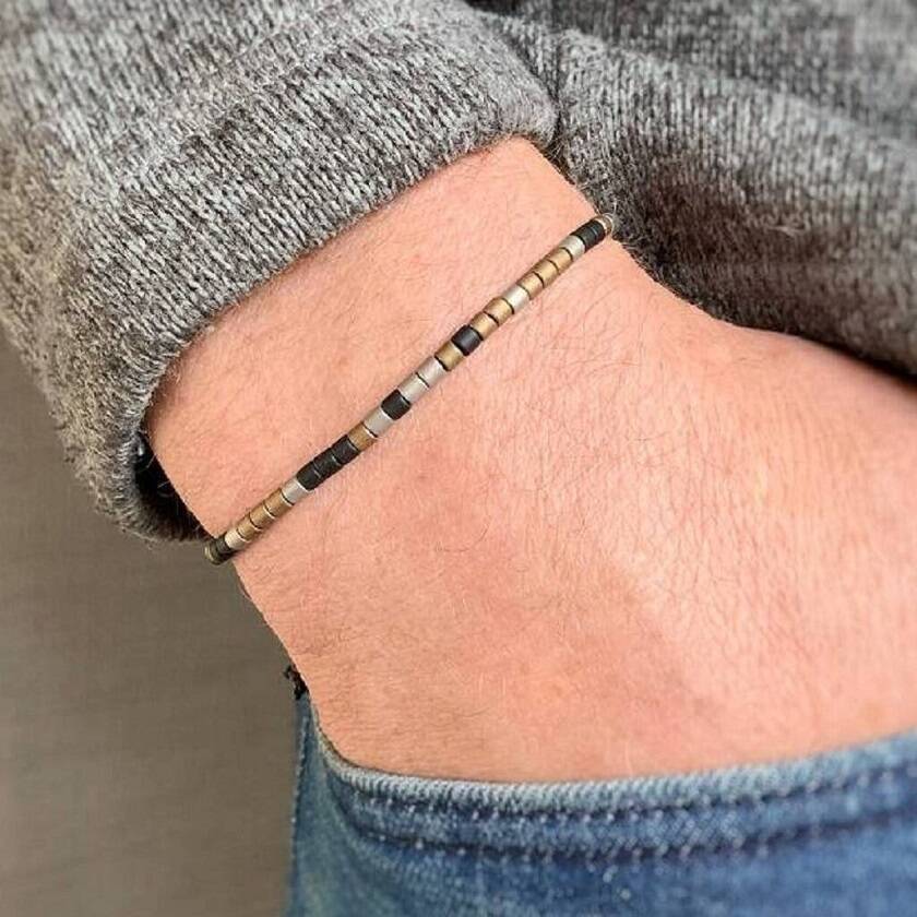 Mens Morse Code Bead Bracelet being worn on wrist - the colour scheme on this More Code Bracelet is 'Antique Gold'