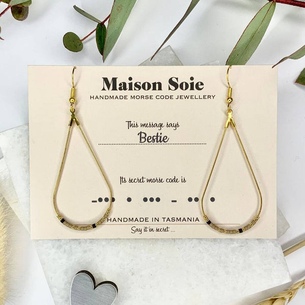 Morse Code Earrings displayed on a presentation card - the beads are arranged using Morse Code to spell out the word 'Bestie'