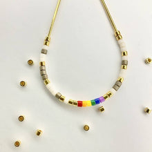 Load image into Gallery viewer, Close up photo of the beads on our &#39;Love Wins&#39; Pride Morse Code Earrings
