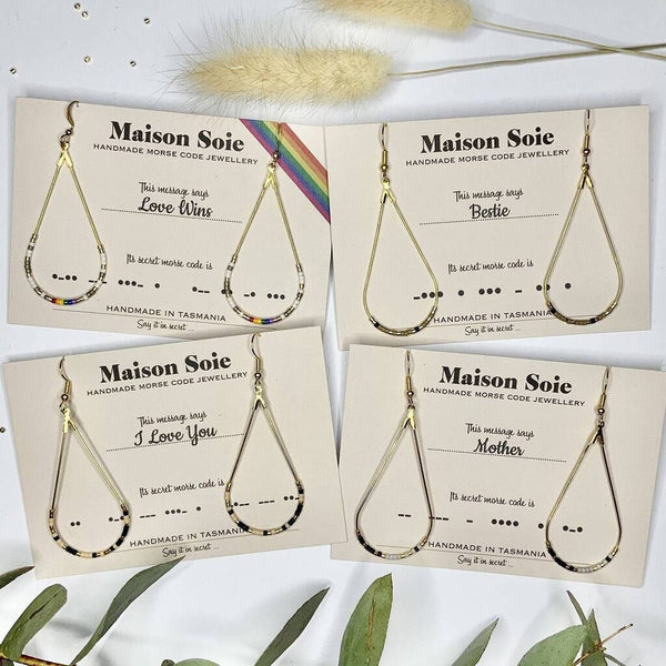 Examples of our Custom Made Morse Code Earrings, displayed on their presentation cards