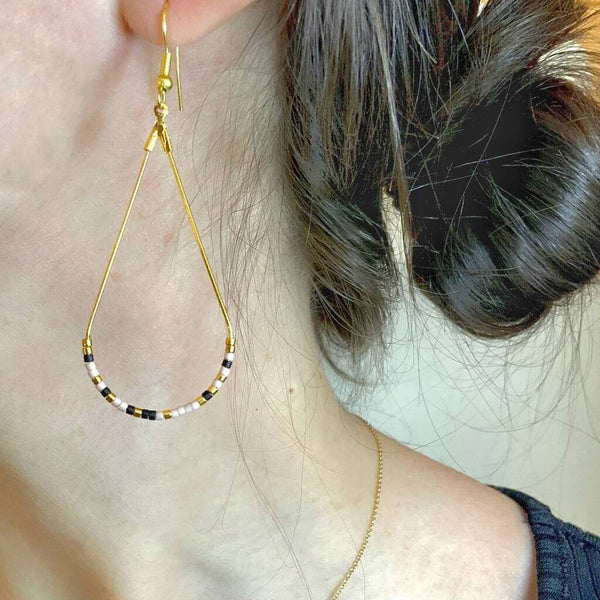 Close up photo of the beads on our Morse Code Earrings