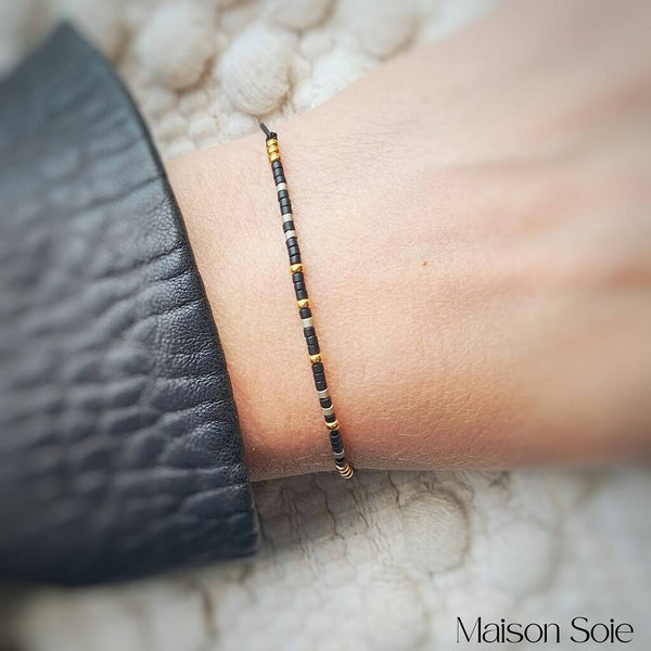 Close-up photo showing the detail of the adjustable sliding bead on our 'Happiness' Morse Code Bracelet