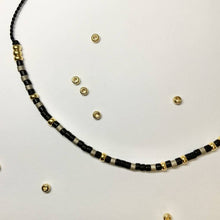 Load image into Gallery viewer, Close-up photo showing the detail of the beads on our &#39;Happiness&#39; Morse Code Bracelet
