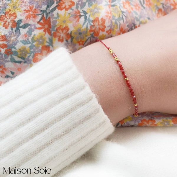 Close-up photo showing the detail of the adjustable sliding bead on our 'I Love You' Morse Code Bracelet
