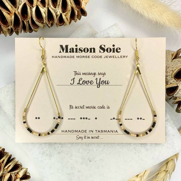 Morse Code Earrings displayed on a presentation card - the beads are arranged using Morse Code to spell out the word 'I Love You'