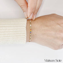 Load image into Gallery viewer, &#39;Love Wins&#39; LGBTQ Pride Morse Code Rainbow Bead Bracelet being worn
