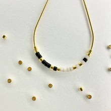 Load image into Gallery viewer, Close up photo of the beads on our Morse Code Earrings
