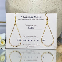 Load image into Gallery viewer, Morse Code Earrings displayed on a presentation card - the beads are arranged using Morse Code to spell out the word &#39;Sister&#39;
