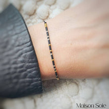 Load image into Gallery viewer, &#39;Tribe&#39; Morse Code Bead Bracelet being worn with black leather jacket
