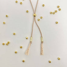 Load image into Gallery viewer, Close-up photo showing the detail of the adjustable sliding bead on our &#39;Valentine&#39; Morse Code Bracelet
